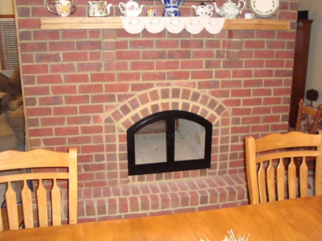 Arched black fireplace